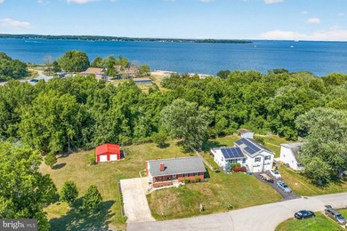Nestled at the end of a peaceful peninsula in the sought-after - photo 9