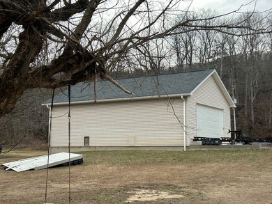 Enjoy nearly an acre of level waterfront property where the - photo 21