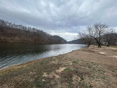 Enjoy nearly an acre of level waterfront property where the - photo 22