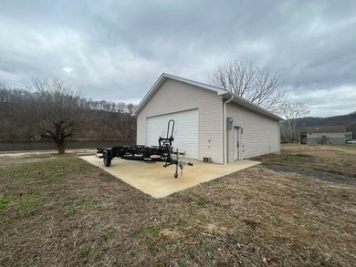 Enjoy nearly an acre of level waterfront property where the - photo 28