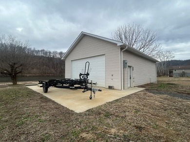 Enjoy nearly an acre of level waterfront property where the - photo 29