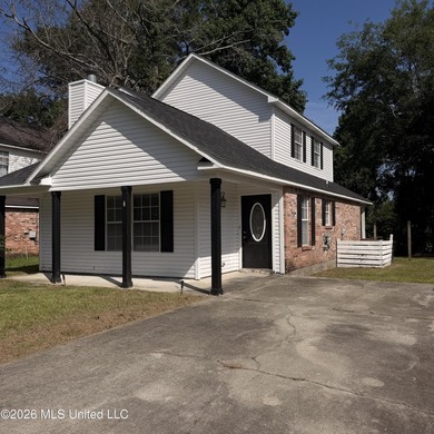 Conveniently located in the heart of D'Iberville, this two-story - photo 1