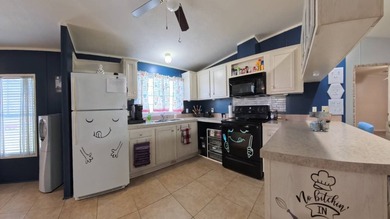 This 2002 double-wide manufactured home offers 3 bedrooms and 2 - photo 23