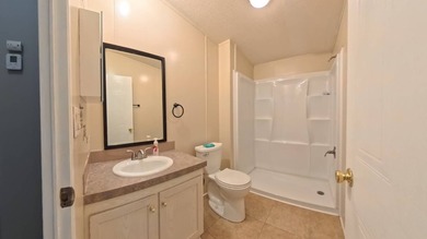This 2002 double-wide manufactured home offers 3 bedrooms and 2 - photo 28