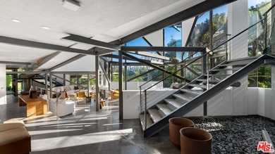 Ocean views, lush natural light, and dramatic angles animate the - photo 9