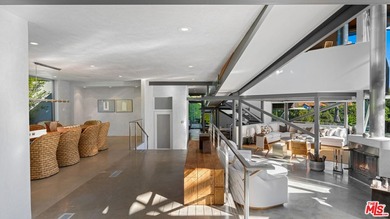 Ocean views, lush natural light, and dramatic angles animate the - photo 10