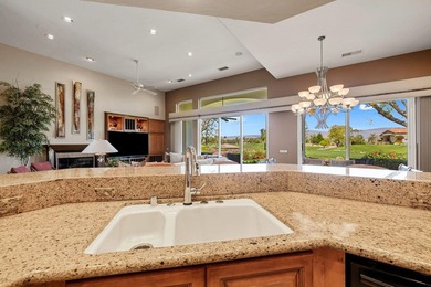 Commanding sweeping fairway and mountain views, this highly - photo 29