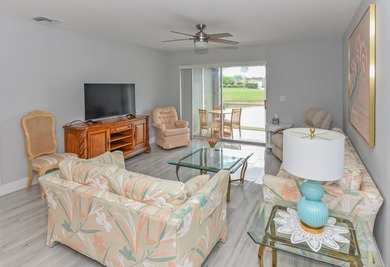 Adorable waterfront villa filled with natural light! This - photo 12