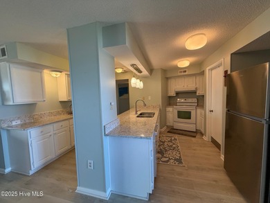 Step into relaxed coastal living with this freshly updated and