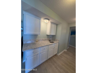 Step into relaxed coastal living with this freshly updated and