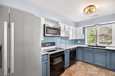 176 Kansas City Way in Sunrise Beach, MO 65079 offers a true - photo 12