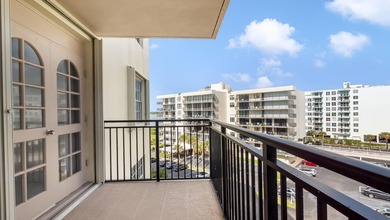 Experience beachfront living at its best in this all-ages condo