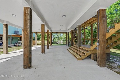 Enjoy coastal living on the beautiful Biloxi Back Bay in this - photo 2