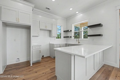 Enjoy coastal living on the beautiful Biloxi Back Bay in this - photo 8