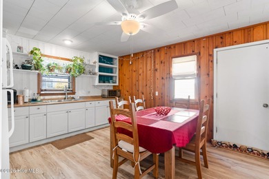 Tucked along a quiet street, this charming coastal cottage