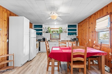 Tucked along a quiet street, this charming coastal cottage