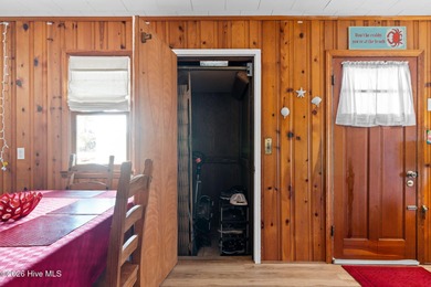 Tucked along a quiet street, this charming coastal cottage