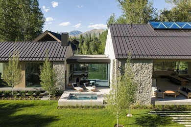 River Lodge, a new riverfront estate set on 2.1 acres along the - photo 21