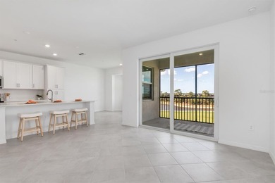 Virtually Staged. WOW! TOP FLOOR, END UNIT CONDO WITH GOLF - photo 3