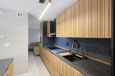 Exquisitely remodeled second-floor condominium in the highly - photo 13