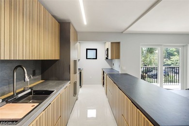 Exquisitely remodeled second-floor condominium in the highly - photo 17