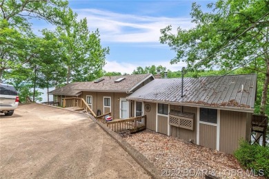 Cute lakefront villa located on MM 30 in Linn Creek MO! This is - Lake Townhome/Townhouse For Sale in Linn Creek, Missouri