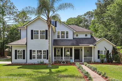 Nestled on a serene nearly 1 acre wooded homesite, this - photo 1