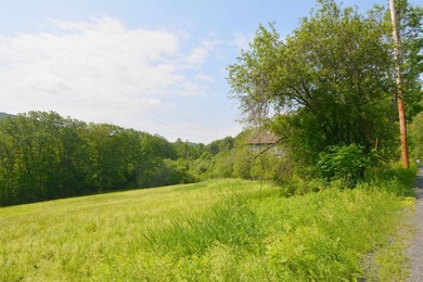 This property is located on a Scenic Road with views. Close to - photo 3