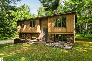 Lake Mitchell Home Active Under Contract in Cadillac Michigan