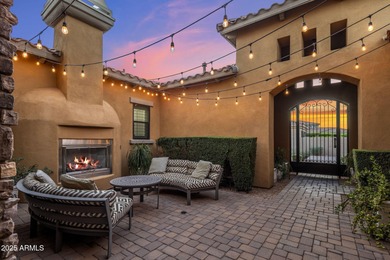 Set on an elevated, private flag lot in the coveted N Scottsdale