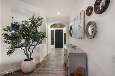 Set on an elevated, private flag lot in the coveted N Scottsdale