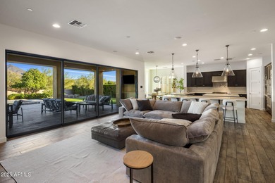 Set on an elevated, private flag lot in the coveted N Scottsdale