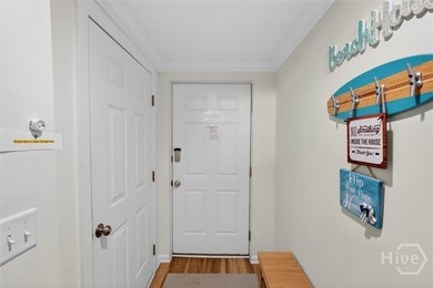 Turn-key coastal living just steps from the sand! This fully - photo 3