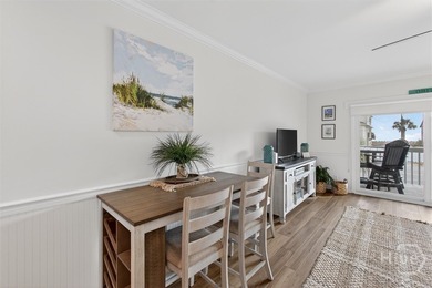 Turn-key coastal living just steps from the sand! This fully - photo 8