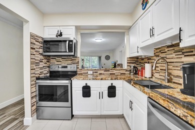 Updated First Floor 2/2 Corner Unit with Water/Preserve Views! - photo 1