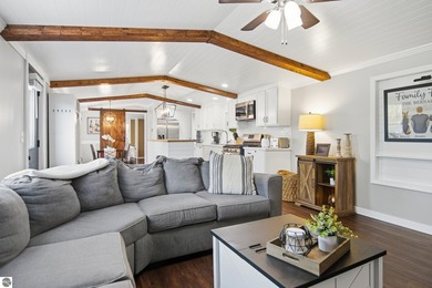 Set on 10 acres just outside Manton, this thoughtfully updated - photo 1