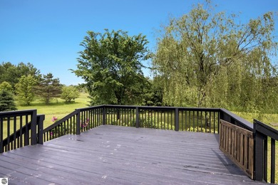 Set on 10 acres just outside Manton, this thoughtfully updated - photo 4