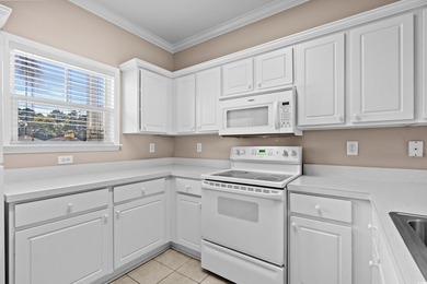 Welcome to this charming 2-bedroom, 2-bathroom first-floor condo