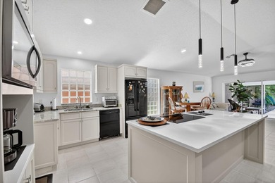 WOW - Awesome pool home with renovated kitchen, flooring and - photo 14