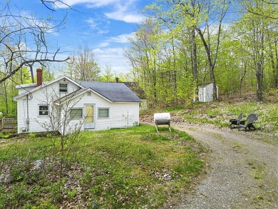 Here's an opportunity to build equity and enjoy Togus Pond. This - photo 3