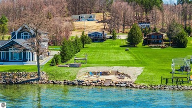 Just in time for summer! 80' of sandy Torch Lake frontage on - photo 1