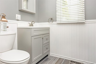 Welcome to this beautifully updated expanded Cape nestled in the - photo 12