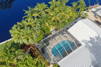 Set along 177' of maturely landscaped wide waterfront, 2124 - photo 2