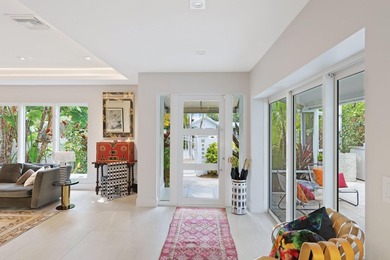 Set along 177' of maturely landscaped wide waterfront, 2124 - photo 5