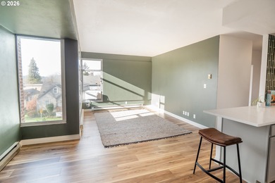 Overflowing with light, this corner condo is comfortable