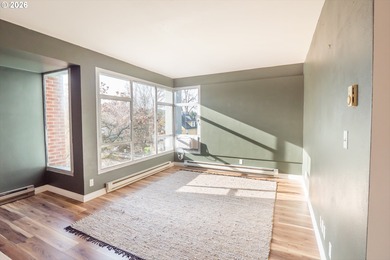 Overflowing with light, this corner condo is comfortable