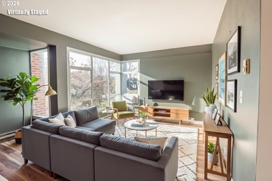 Overflowing with light, this corner condo is comfortable