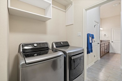 This immaculate 4-story townhome, ideally located on a quiet