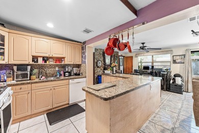 4BR/2BA single-family home with 1,707 sq. ft. under air. This - photo 12