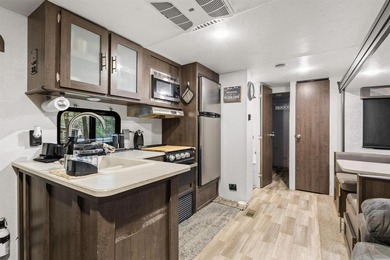 Discover a unique opportunity just steps from Cedar Mills Marina